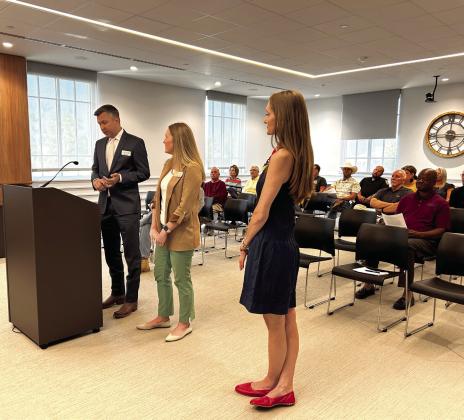 Pictured from left, OKCPhil Executive Director Brent Hart, Education and Community Engagement Director Shannon Lockwood, and the President of the Orchestra League Rachael Geiger, address the Board of County Commissioners regarding a Christmas concert to be held in Pottawatomie County. Suzie Campbell, Countywide &amp; Sun
