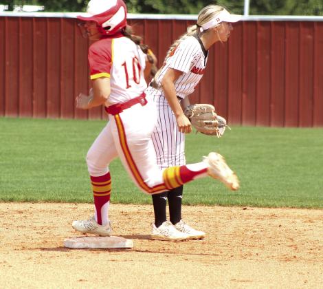 Dale senior, pitcher Daley Lang steps on second base on her way to third after hitting a triple in the Class 4A Regional Slow Pitch Tournament.