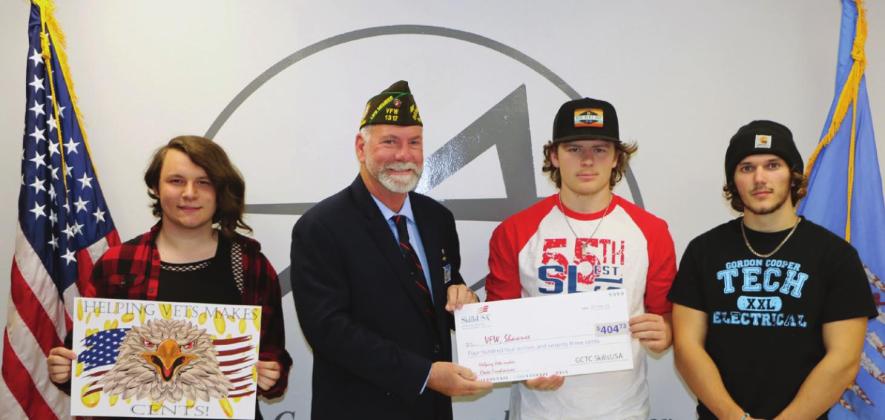 SkillsUSA students at Gordon Cooper Technology Center collected 8,615 pennies and raised $404.73 to help local veterans with their “Helping Vets Makes Cents” coin drive. Pictured from left are Graphic Design student Sheldin Mills, Shawnee HS, holding the design created by Alexandria Flatt, Bethel HS; Patrick Koch, VFW Post 1317/Jr. Vice Commander, Shawnee; Kaden Johnson, Electrical Trades and Meeker HS; Brett Mingo, Electrical Trades and Meeker HS.