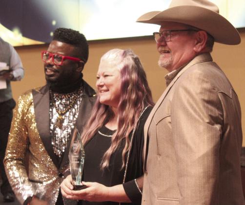 Tecumseh Chamber Executive Director Kimberly Elliott, center, accepts the Impact Award from Jamelle Payne, left, with CPN, and Derek Barton, with KGFF. Natasha Dunagan, Countywide &amp;amp; Sun