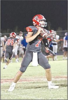 North Rock Creek’s Landon Kelough looks for an open receiver.