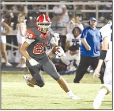 North Rock Creek’s Caleb Hawkins puts a move on the Little Axe defender.