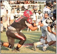North Rock Creek’s Andrew Ritter grabs the Little Axe ball carrier during the opening game hosted by NRC Friday, Sept. 1. NRC won 21-0.