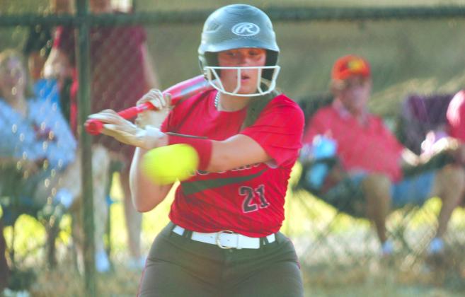 Macomb senior Cassi Johnson passes on a close ball and eventually walks in the game at Maud on Aug. 8. Macomb won, 19-6.