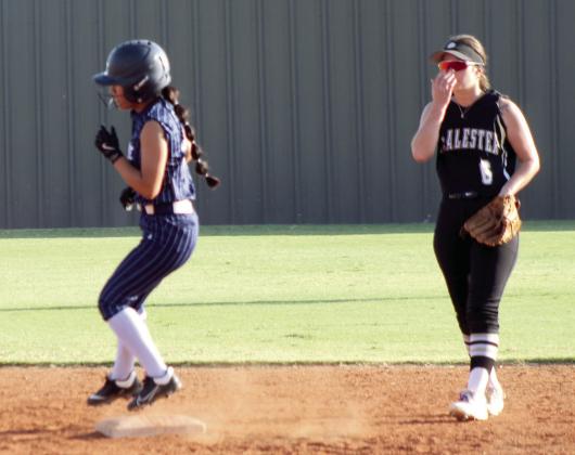 Shawnee's Clarissa Lena hits a double and hops onto second base during the second inning of the Aug. 20 home game against McAlester.