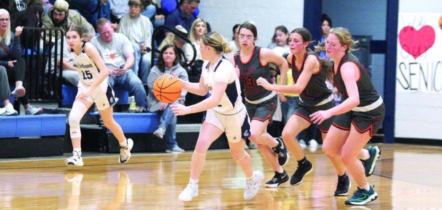 After stealing the ball, Asher’s Makaylee Herrell is followed by three Carney defenders on the way to the hoop at the end of the fourth quarter of the Nov. 22 home game. The Lady Indians won, 42-11. Countywide &amp; Sun/Natasha Dunagan
