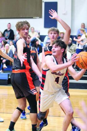 Asher’s Kelby Fowler grabs the rebound and looks to pass during the first quarter.