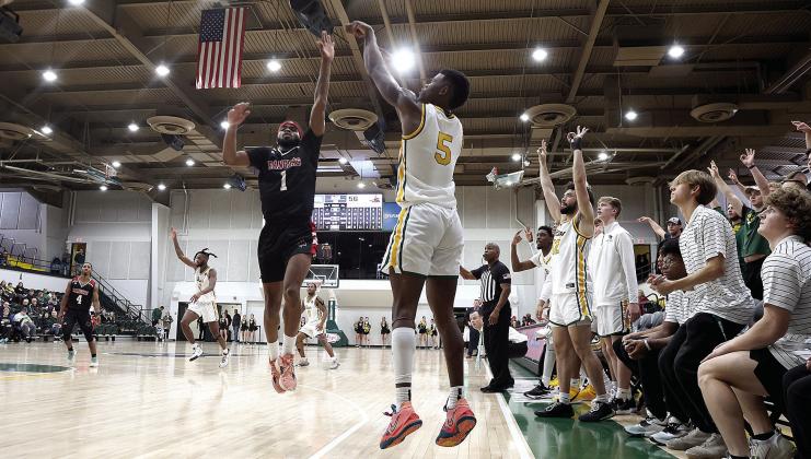 Oklahoma Baptist University’s junior Ricky Brown launches a shot from outside the 3-point circle. Photo provided