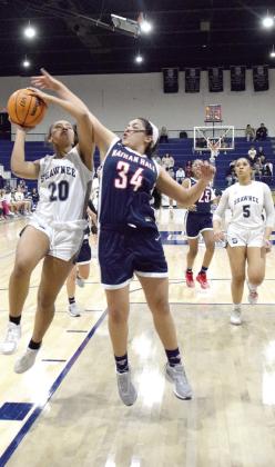 Freshman Amiyah Briones fights for the basket in the Feb. 14 game against Nathan Hale. The Lady Wolves dominated the court with a 59-3 win. Countywide &amp; Sun/Julie Talton