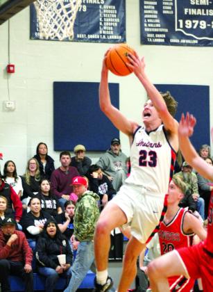After stealing the ball, Asher’s Mikey Van Schuyver storms the basket for two points in the second quarter of the home game.