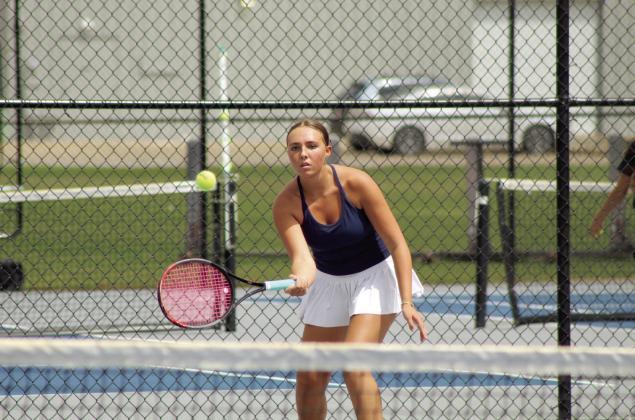 Shawnee senior Alivia Cook keeps her eye on the ball during the Suburban Conference Tournament on April 13. Cook placed second in #2 Singles. The Lady Wolves team also placed second overall.
