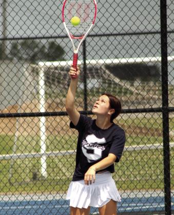 Shawnee sophomore Madalyn Rosenquist serves during the Suburban Conference Tournament on April 13. Rosenquist is on the #1 Doubles team with senior Isabela Garza, and they placed second.