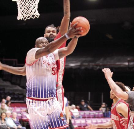 Potawatomi Fire Forward/Center Paul Harrison eyes the basket. Harrison added 15 points and six rebounds during that game, according to potawatomifire.com. Natasha Dunagan, Countywide &amp; Sun