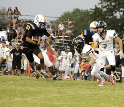Bethel sophomore Dallas 'Dre' Fixico dodges the Little Axe defense while making yardage during the first game of the season on Aug. 28. The Bethel Wildcats won 50-0, and their next game will be against Luther tonight, Sept. 3, at 7 pm. Photos by Natasha Dunagan, Countywide &amp;amp; Sun