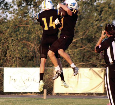 Bethel senior Luke Hurt (#11) celebrates with fellow senior Hunter Brooks after making a touchdown during the first game of the season.