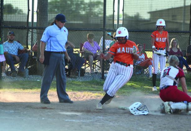 Maud’s Amerikus Street dodges the Vanoss catcher and makes it to home base in the second inning of the game against Vanoss.