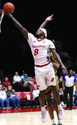 Potawatomi Fire Forward KD Moore adds two points from a layup in the home game against the Muskogee Sky Kings on April 24. Moore had 34 points and six rebounds in the game. Photos courtesy of Kent Bush, CPN