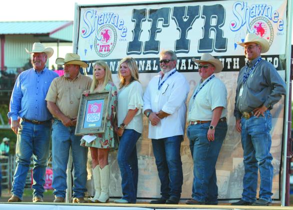 Past Chairman of the SCCDA Randy Gilbert, far left, presented a framed 2025 IFYR logo to the Pottawatomie County Commissioners, Greg Rush, Melissa Dennis and Abby Thompson, during the rodeo on July 9. Over the last year, the SCCDA was dissolved, and the county commissioners took ownership of the IFYR. Also shown is Shawnee Mayor Eric Stephens, State Representative Dell Kerbs and IPRA/IFYR General Manager Dale Yerigan. Natasha Dunagan, Countywide &amp; Sun