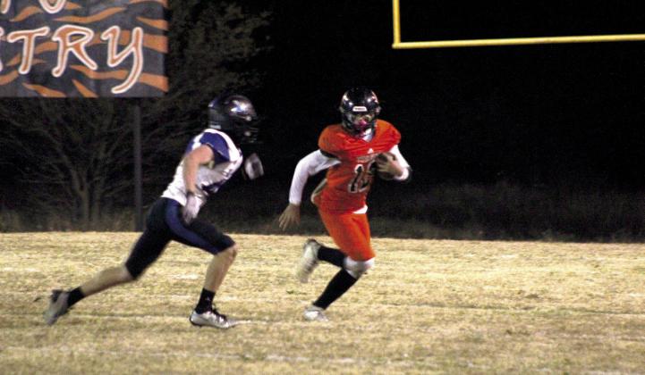 With a quarterback keeper, Maud freshman Evan Buxton runs the ball in the third quarter of the Class C OSSAA First-Round Playoffs.