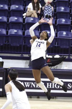Shawnee senior JaNya Bruner prepares an attack during the second match of the Aug. 27 home meet against El Reno.