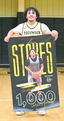 Tecumseh senior Aveon Stokes was presented with a banner celebrating his achievement of 1,000 career points on Jan.6. Photo provided