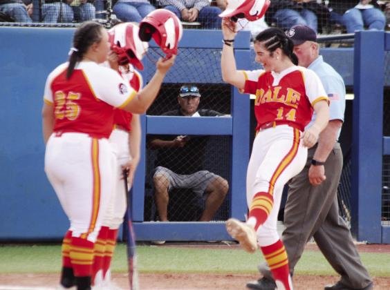 Dale junior Karsen Griggs celebrates with her teammates at home base after hitting a home run in the fifth inning of the State Finals.