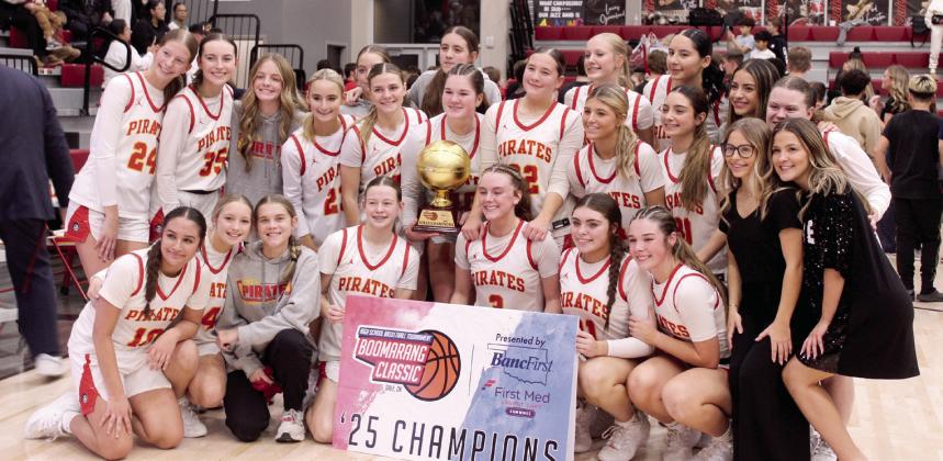 The Dale Lady Pirates pose with their trophy after winning the Dale Boomarang Basketball Classic on Dec. 13. Over the three-day tournament, they won all three games: Mustang JV, 77-32; Alva/Freedom, 53-44; and, Washington, 75-69. Their head coach is Eric Smith. Photos by Natasha Dunagan, Countywide &amp;amp; Sun