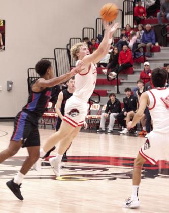 Dale senior Denton Forsythe launches the ball toward the basket after recovering a rebound.