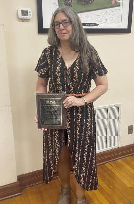Macomb High School Math Teacher Sharon Spikes poses with her Mathematical Association of America Oklahoma Teacher of the Year Award. Photo provided.