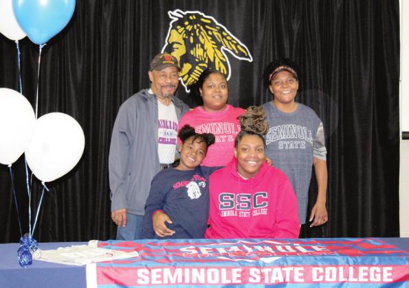 Tecumseh senior Schantel Evans signed a basketball scholarship with Seminole State College on March 10.