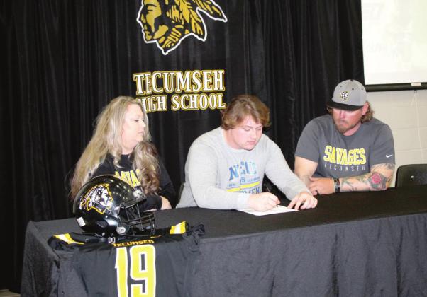On March 9, Tecumseh senior Tyler Girod signs a football scholarship with Northeaster Oklahoma A&amp;M College.