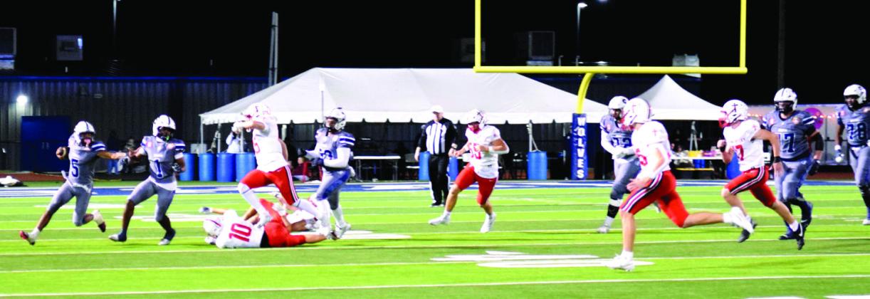 Braylon Lassiter makes the run for a first down in the Halloween home game against Bishop Kelley. The Wolves were tied until the last few seconds when the Comets kicked a field goal for the 27-30 win. Julie Talton, Countywide &amp;amp; Sun
