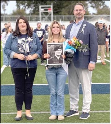SHS Senior Eliana Rao pictured with mom and step-dad, Leah and Chance Allison. Eliana is holding a photo of her father, Elijah Rao, who gave his life serving our country in Afganistan in 2009. Photo Provided