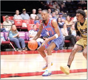 Potawatomi Fire Forward Ricky Artis II drives to the hoop. Photos by Natasha Dunagan, Countywide &amp; Sun