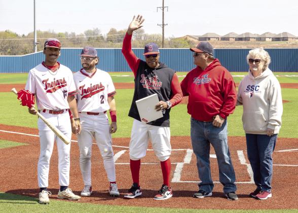 Pictured from left, SSC sophomores Kendall McDowell and Wilfred Gonzalez, Head Coach Mack Chambers, Board of Regents Chair Curtis Morgan and President Lana Reynolds gather on Lloyd Simmons Field to honor Chambers for his 200th win as head coach of the Trojans. Photo provided
