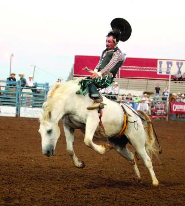 Jaxson Thurmon of El Dorado, AR, loses his hat in the bareback bronc event of the IFYR on the evening of July 15. Thurmon earned first place in the final event standings with a score of 68 for his first two rides and