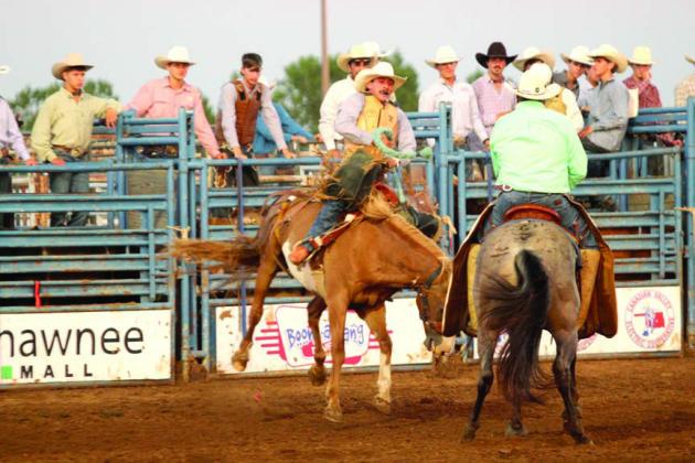Kolt Mendenhall of Boswell, OK, hangs onto the rope in saddle bronc during the IFYR on the evening of July 16. Mendenhall placed eighth in the final saddle bronc standings.