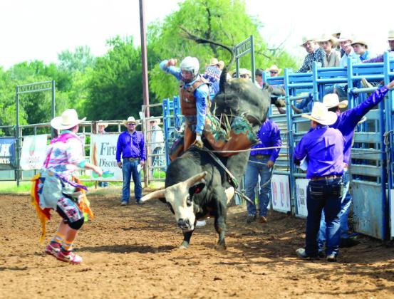 Cohen Haydel of Prairieville, LA, tries to balance as his bull launches from its chute in the bull riding event of the International Finals Youth Rodeo at the Heart of Oklahoma Expo Center on the morning of July 14.
