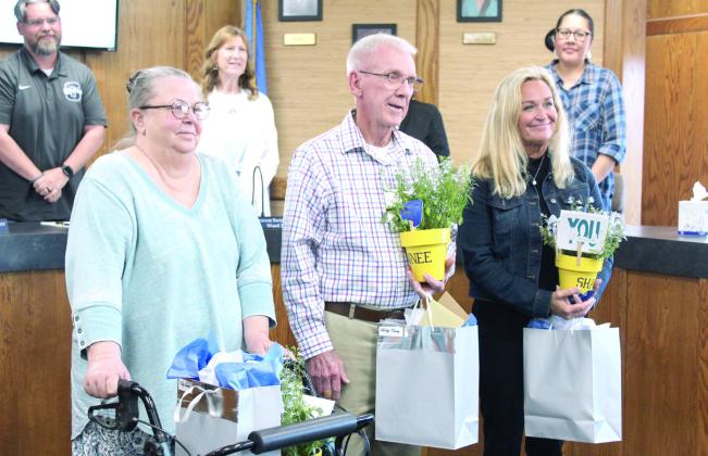 Administrative Assistant Kelly Laster, Board Member Bobby Canty and Second-grade Teacher Andrea Thomas are retiring this year and were honored during the Shawnee Board of Education meeting on May 5. They were presented with commemorative clocks, as well as plants from Shawnee FFA students. Natasha Dunagan, Countywide &amp; Sun