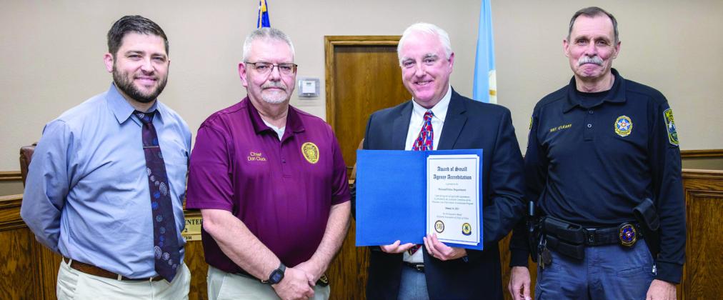 McLoud Police Department receives its accreditation certificate during the Feb. 27, 2025, meeting of the City Council. Pictured from left are McLoud Mayor Daniel McClure, Tuttle Police Cheif Don Cluck, McLoud Police Cheif Kyle Webb and McLoud Police SGT. Michael O'Leary. Photo courtesy of Monica Poindexter
