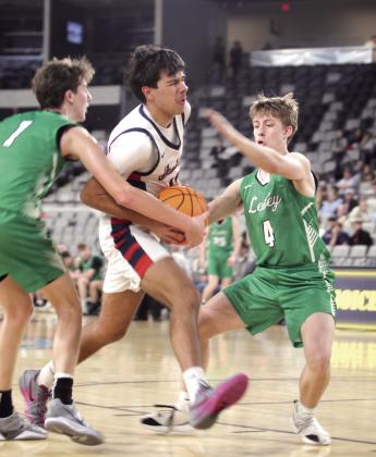 Asher's Casen Foster tries to break through the Leedey defense on his way to the hoop in the third quarter of the Class B2 State Quarterfinal game. Photos by Natasha Dunagan, Countywide &amp;amp; Sun