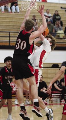 McLoud senior Bryce Cowns aims for the hoop during the regional consolation game against Purcell on Feb. 27. The Redskins lost a close game, 53-56. Natasha Dunagan, Countywide &amp;amp; Sun