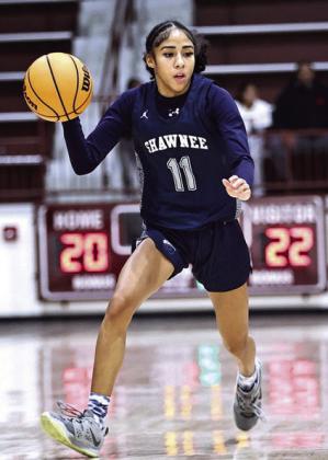 Shawnee High School's Tarilyn Thierry brings the ball up court on Jan. 10 at the ECOS invitational in Ada. The SHS Lady Wolves brought home the Championship Trophy with a 55-54 Overtime win against Deer Creek. Photo Provided by Gowin Photography