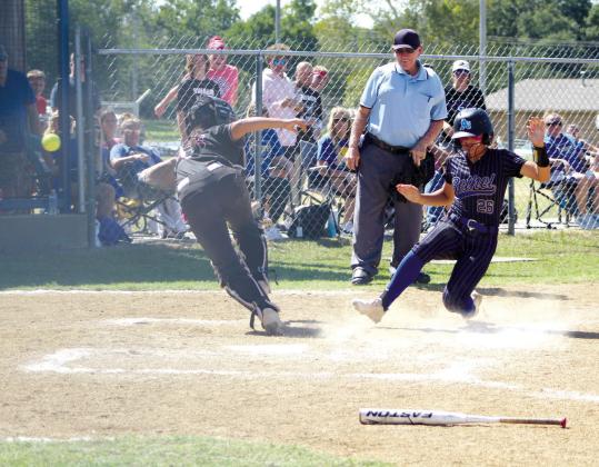 Bethel freshman Bailey Tucker slides into home as the Sequoyah (Tahlequah) catcher chases the ball in the seventh inning of the Class 3A Super Regional Tournament on Sept. 28. The Lady Wildcats won their first game on Sept. 27, but lost the next two over the two-day tournament held at Bethel. They end their season with a record of 26-11.