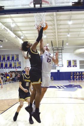 Tecumseh’s Jace Edwards and Bethel’s Bray Bussell fought to the finish in the double overtime matchup on Feb. 2nd. The Savages took home the win 64-60. Countywide &amp;amp; Sun/Julie Talton
