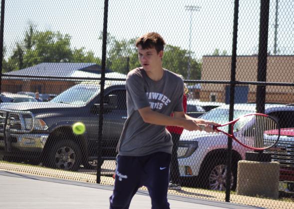 Shawnee senior Hagen Wells returns the ball to his Norman opponent in #1 Singles during the Shawnee NGB (National Governing Body) Tournament on May 3. The boys played that day, but the girls tournament on May 2 was canceled due to rain. Natasha Dunagan, Countywide &amp;amp; Sun