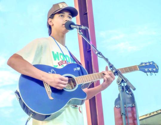 Daniel Bowlan sings his original, 'My Time,' at the 2026 Woody Guthrie Festival in Okemah. Photo Provided