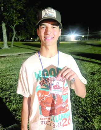 Daniel Bowlan shows off his 2026 WoodyFest official Artist lanyard after being invited to perform his own set. Photo Provided
