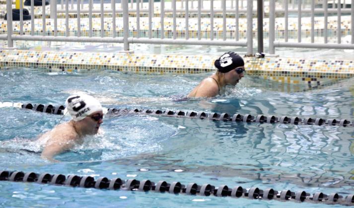 Shawnee swim team athletes, Penelope Spence and Myleah Caruso, compete in the 200 Intermediate Medley during the home meet, Dec. 9. Natasha Dunagan, Countywide &amp; Sun