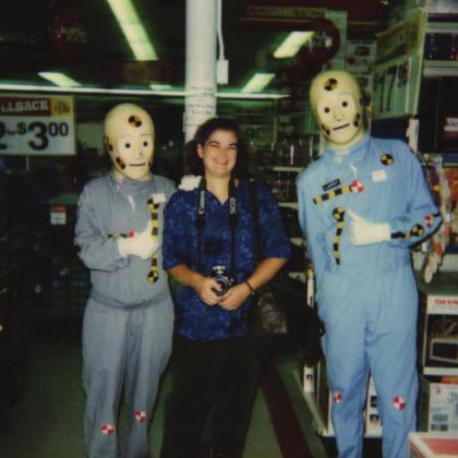 Natasha Dunagan, age 25, poses with “Crash Dummies” at a local Walmart, during her time as a journalist at “The Marshfield Mail,” July 1999. Photo Provided.